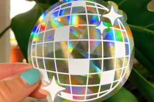 Disco ball sticker that is a sun catcher and shows the rainbow flares from the sun